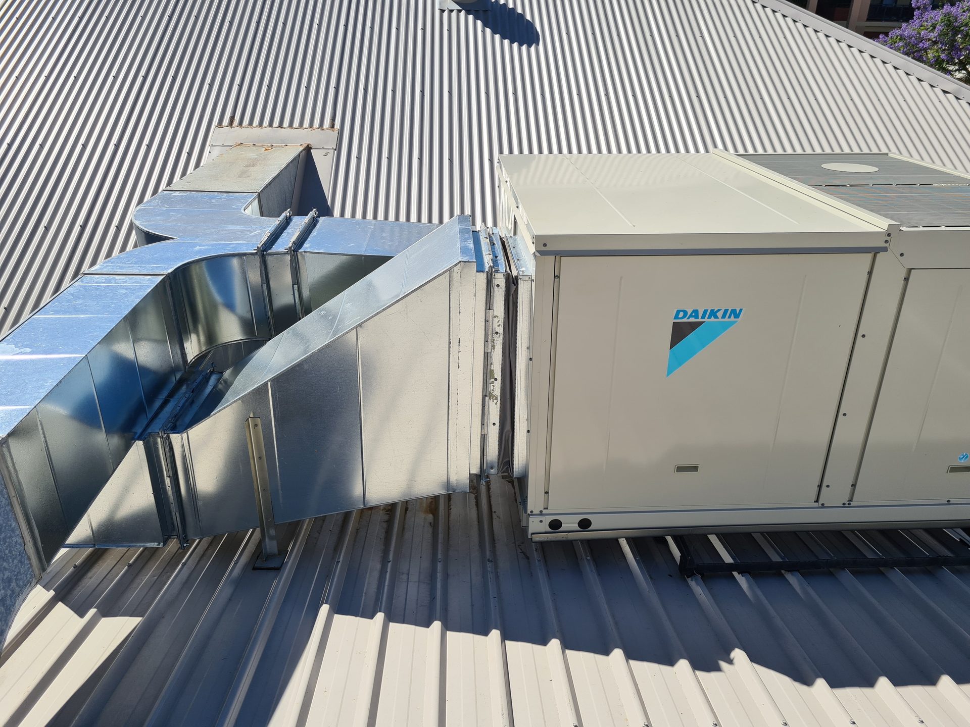 Daikin commercial rooftop air conditioning unit with galvanised ductwork